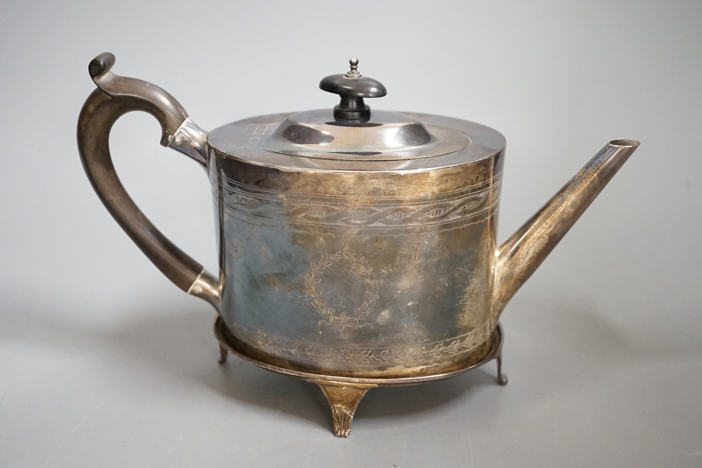 A George V 18th century style silver oval teapot on stand, by Elkington & Co, Birmingham, 1911